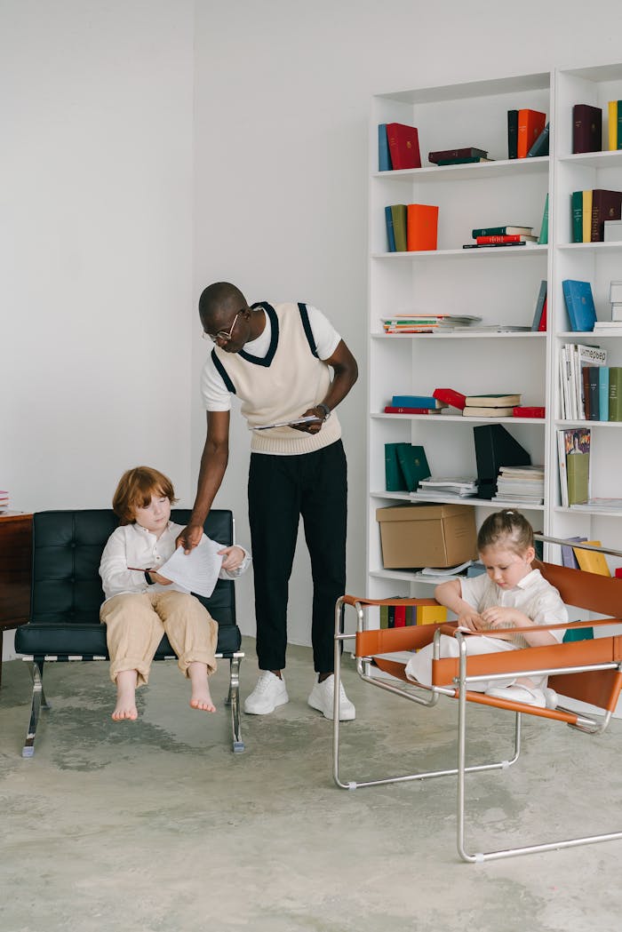 Therapist interacting with children during a therapy session in an office environment.